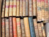 a box full of old books sitting on a table