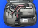 a black case with a camera and other items in it