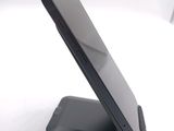 a cell phone that is sitting on top of a stand