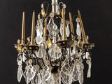 an image of a chandelier hanging from a black ceiling