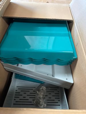 a box with a blue lid that is inside of it