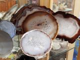a glass display case filled with lots of different types of agate