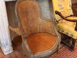 two chairs that are sitting in front of a fireplace