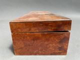 an old wooden box sitting on top of a table
