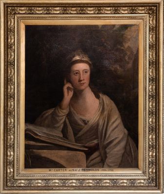 portrait of a woman reading a book in a gold frame
