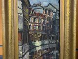 an oil painting of a street scene in a gold frame