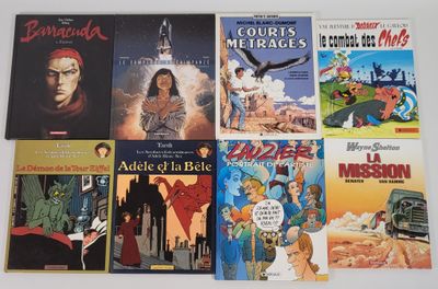 Plusieurs albums de BD sont alignés sur une surface blanche