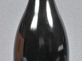 a bottle of wine that is sitting on a table