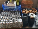 a table with a lot of bottles and containers on it