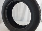 a close up of a tire on a white surface