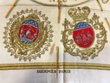 a close up of a coat of arms with a crown on it