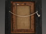 an old wooden frame with a rope on top of it