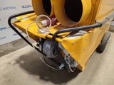 a yellow machine that is sitting on the ground