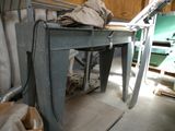 a table with a cloth on top of it in a room