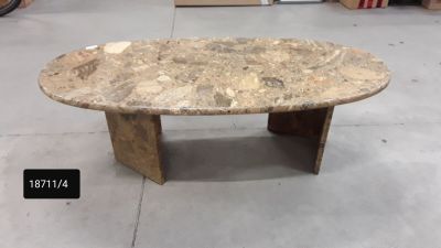 a marble table with a wooden base in a store