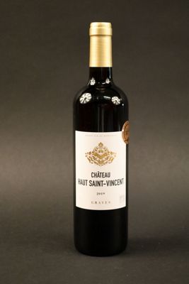 a bottle of wine that is sitting on a table