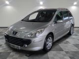 a picture of a silver car parked in a garage