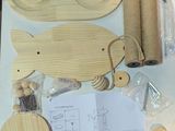 a table that has a bunch of wooden items on it