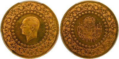 a gold coin with a portrait of a man on it