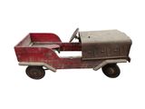 a small red toy truck with a steering on a white background