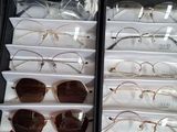 many pairs of glasses on display in a case