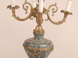 a gold candelab with five candles on it