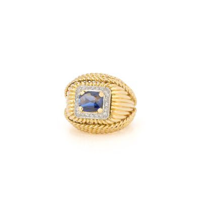 an 18k yellow gold ring with sapphire and diamonds