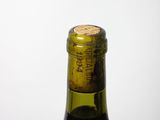 a bottle of wine that is sitting on a table