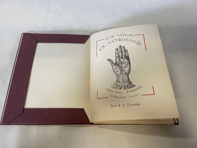 an open book with a picture of a hand on it