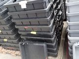 a lot of plastic containers stacked on top of each other