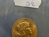a close up of a gold coin with a label on it