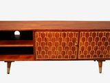 a close up of a wooden entertainment unit with shelves and shelves