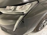 a close up of a car ' s headlight and front bumper