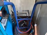 a blue machine that is sitting next to a wall