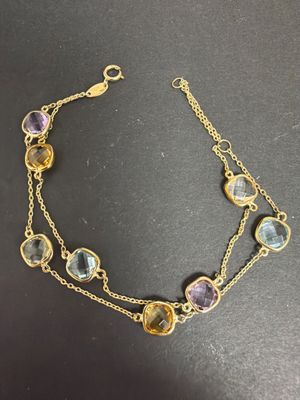 Bracelet double en or jaune 375/°°, ornée de topazes, améthy…