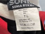 an image of a label on a red and black jacket