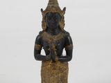 an image of a statue of a woman holding a flower in her hands
