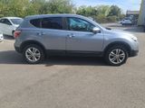 a picture of a silver suv parked in a parking lot