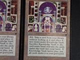 two cards that are sitting on a table