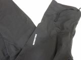 the back of a pair of black pants with a white logo on it