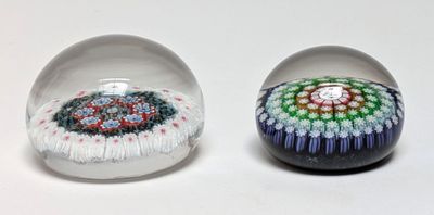 two glass balls that have different designs on them