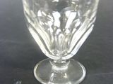 a glass cup that is sitting on a table