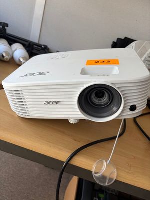 an image of a projector sitting on top of a wooden table
