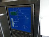 an image of a stainless steel refrigerator with a blue screen