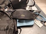 a black bag and a blue bag on a table