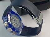 a watch that is sitting on a table next to a bag