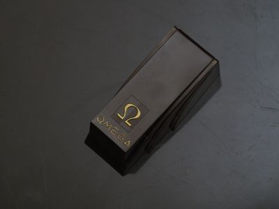 an image of a black box with a gold symbol on it