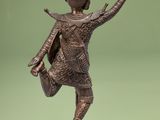 bronze statue of a man holding a basket on a pedestal
