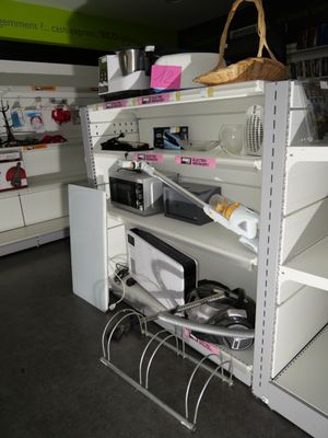 a shelf with many items on it in a store
