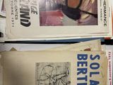 many books that are stacked on top of each other